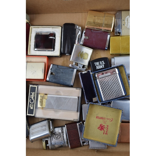 375 - A mixed collection of vintage cigarette lighters to include boxed examples by manufacturers Calibre,... 