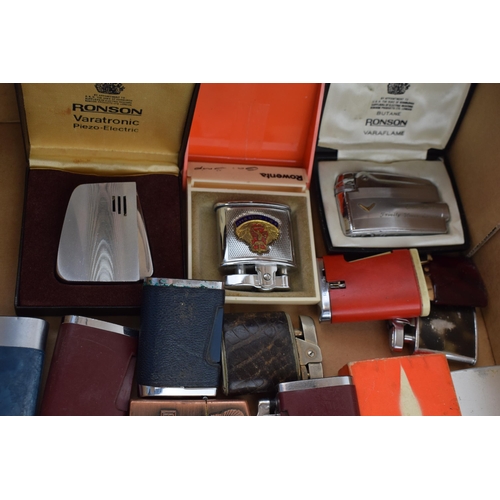 376 - A mixed collection of vintage cigarette lighters to include boxed examples by manufacturers Calibre,... 