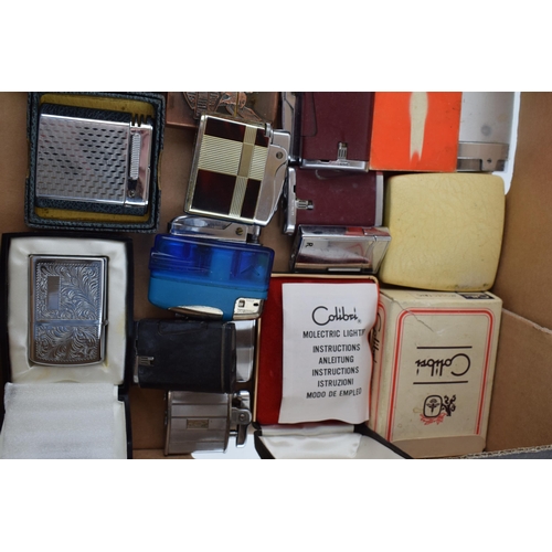 376 - A mixed collection of vintage cigarette lighters to include boxed examples by manufacturers Calibre,... 