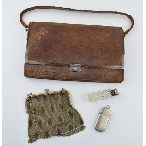 380 - A collection of items to include a crocodile skin purse, with silver clasps and mounts. A silver top... 