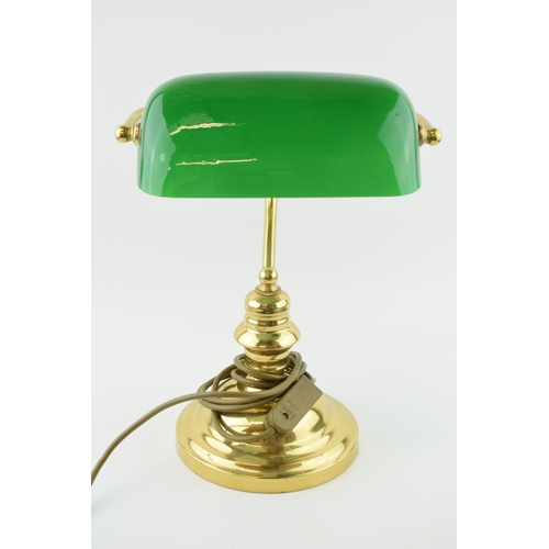 384 - A bankers lamp with brass base and green glass shade. Height 36cm.