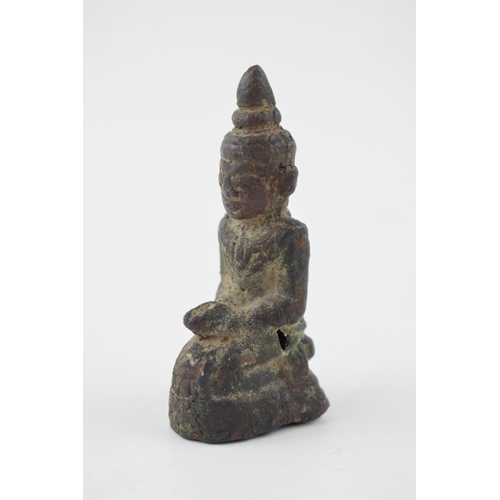 386 - Miniature bronze figure of a Tibetan Buddha, 6.5cm tall.