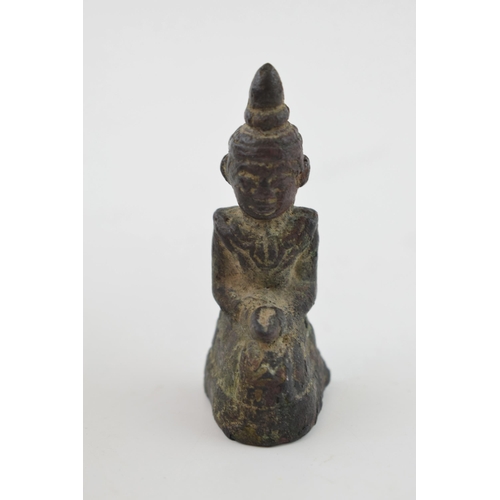 386 - Miniature bronze figure of a Tibetan Buddha, 6.5cm tall.