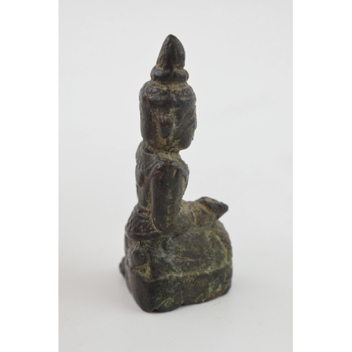 386 - Miniature bronze figure of a Tibetan Buddha, 6.5cm tall.