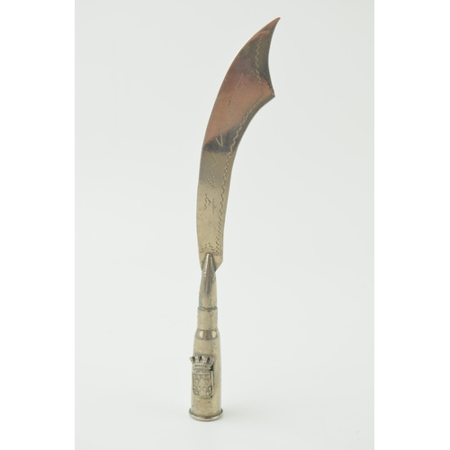 389 - A 20th century trench art figure to include a bullet with 'Picardie' crest with cutlass style blade ... 