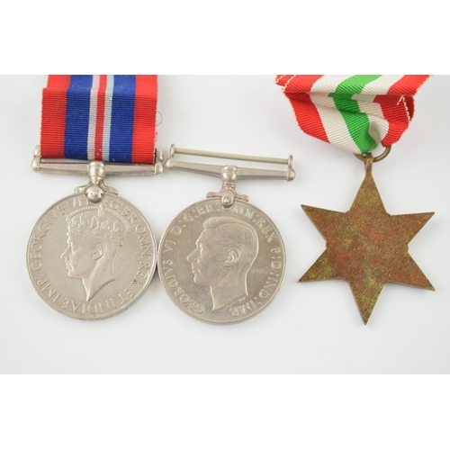 392 - A WWII War Service medal together with a Defence Medal and an Italy Star. (3)