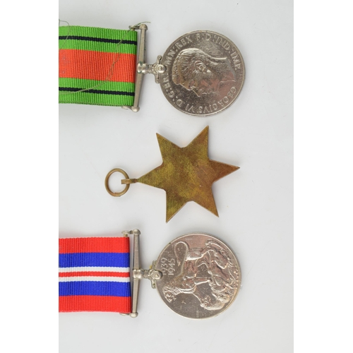 393 - A WWII War Service medal together with a Defence Medal and an Africa Star. (3)