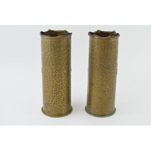 397 - A pair of Trench Art vases, 23cm tall, with grape and vine decoration, possibly 1916.