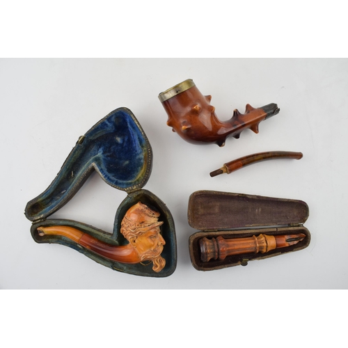 403 - A collection of smoking related items to include a Briar pipe with hallmarked silver mount and amber... 