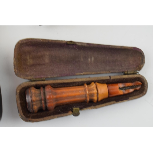 403 - A collection of smoking related items to include a Briar pipe with hallmarked silver mount and amber... 