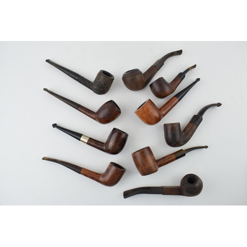 405 - A collection of vintage tobacco smoking pipes to include briar examples by 'Invicta', 'Riseagle and ... 