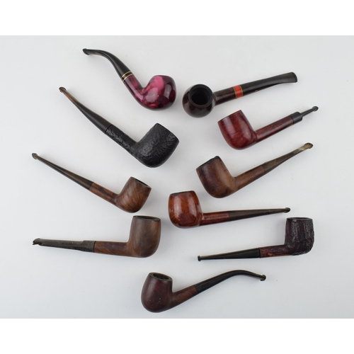 407 - A collection of vintage tobacco smoking pipes to include briar and similar examples by 'St Claude', ... 