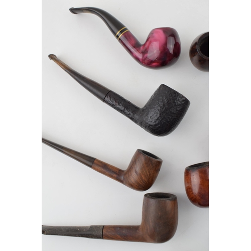 407 - A collection of vintage tobacco smoking pipes to include briar and similar examples by 'St Claude', ... 