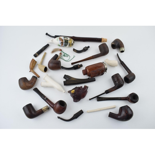 411 - A collection of vintage tobacco smoking pipes to include briar, clay and ceramic examples in varying... 