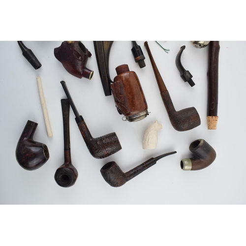 411 - A collection of vintage tobacco smoking pipes to include briar, clay and ceramic examples in varying... 