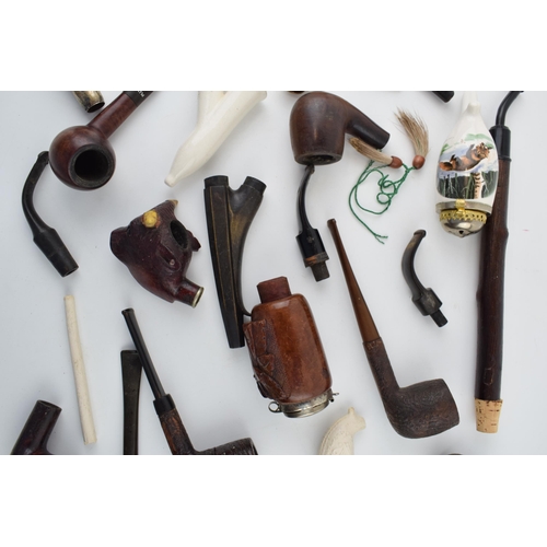 411 - A collection of vintage tobacco smoking pipes to include briar, clay and ceramic examples in varying... 