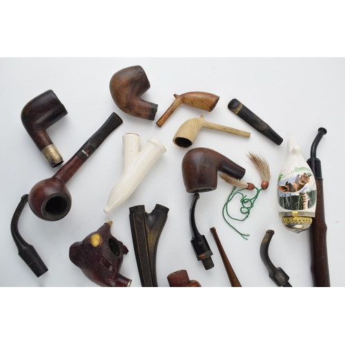 411 - A collection of vintage tobacco smoking pipes to include briar, clay and ceramic examples in varying... 