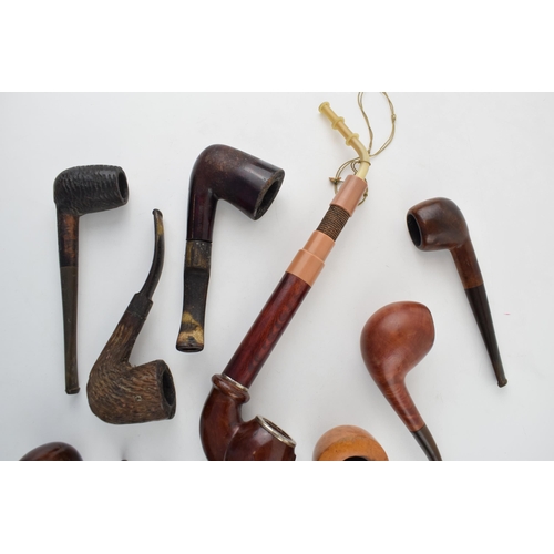 412 - A collection of vintage tobacco smoking pipes to include briar examples by 'I R Navy, 'Clifton' and ... 