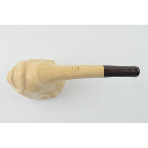 416 - A clay pipe in the form of a man's head. Length 14cm.