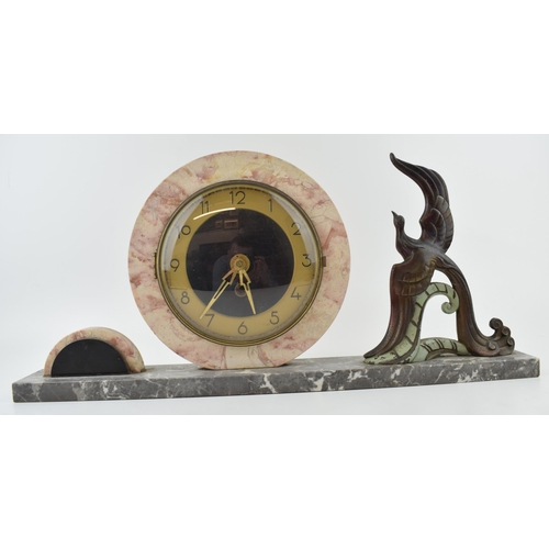 420 - French Art Deco mantle clock, flanked by a large peacock, 50cm long.