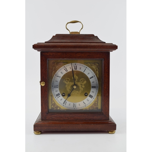 427 - Quality reproduction bracket clock, with four brass bun feet, untested, with key, 24cm tall.