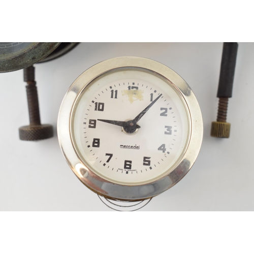 451 - A collection of car clocks to include examples by Smiths, Jaeger and Mercedes. (3)