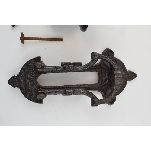 455 - A Kenrick and Sons or similar door knocker together with a ceramic Victorian door knob. (2) 23cm.