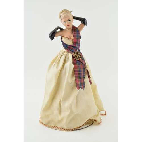 460 - A lamp in the form of a lady in gown. Celluloid construction with wire frame. c1950s. Height 39cm.