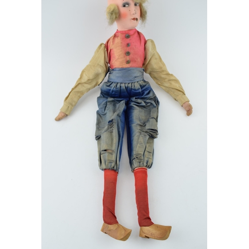 461 - A boudoir doll in the form of a Dutch Lady in clogs. Silk clothes, composition head and hand painted... 