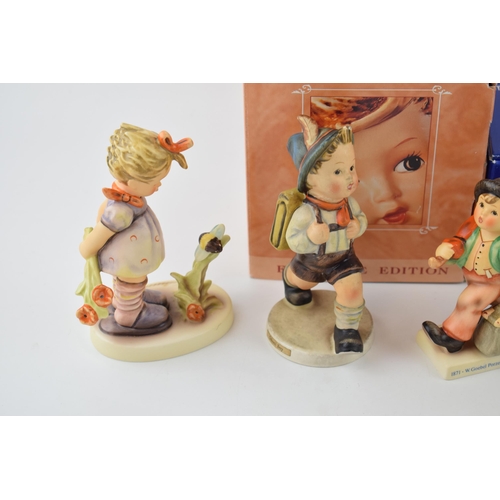 104 - A collection of Goebel figures to include Sister, Private Conversation, Merry Wanderer (boxed), Scho... 