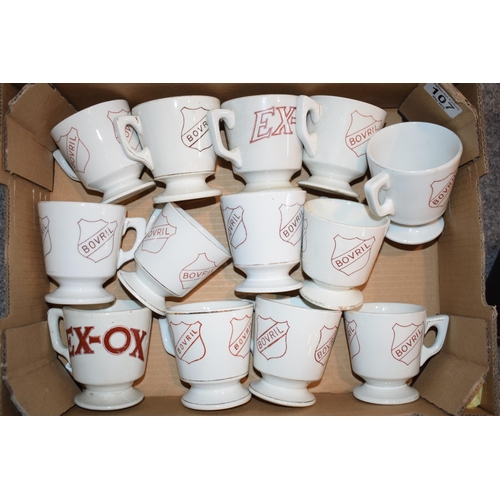 107 - A collection of 'Bovril' and 'Exox' advertising cups to include antique and vintage examples. (13)