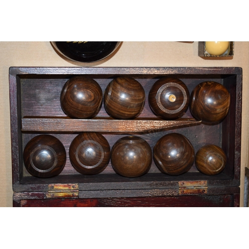 340 - A set of indoor bowls by Henry A. Murton Ltd in lignum vitae in original box together with vintage b... 