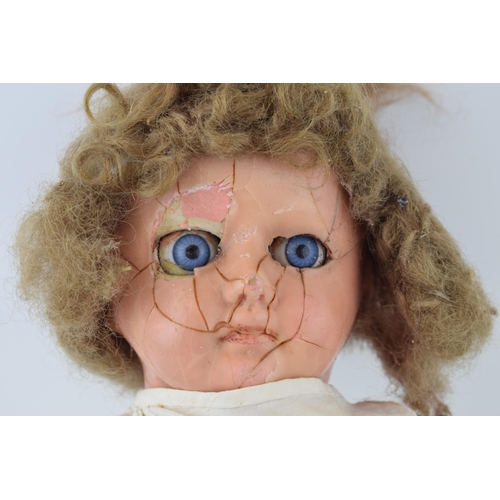 463 - Wax head over papier mache doll, moving eyes, crazing to face. c1860s.