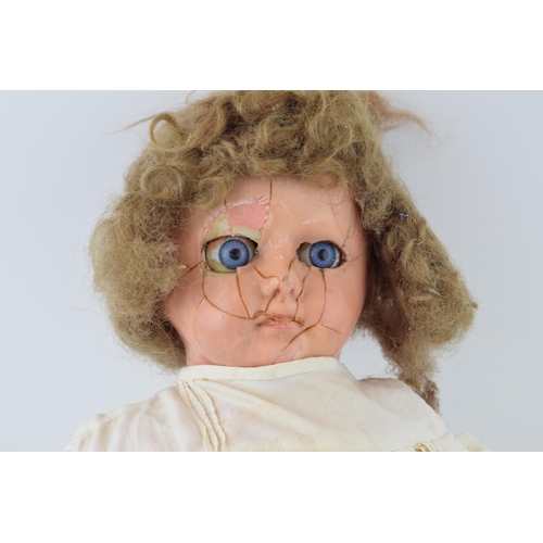 463 - Wax head over papier mache doll, moving eyes, crazing to face. c1860s.