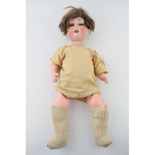 469 - Bisque head doll marked WG possibly William Gobel, Head good requires re-stringing. Height 54cm.