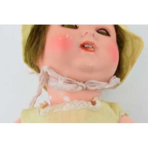 470 - Bisque head doll 170 3/0 Made in Germany. Teeth present. Height 36cm.