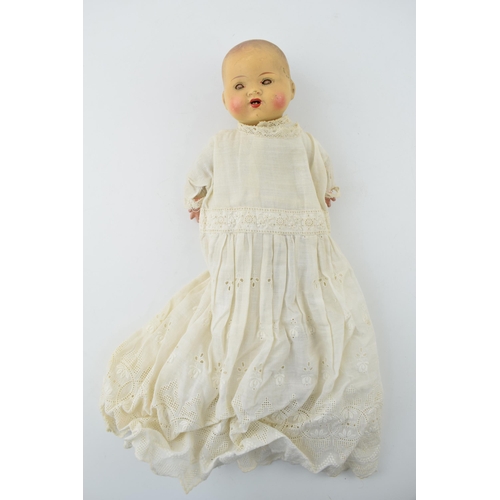 474 - Bisque head doll with sprayed head and moving eyes. AM made in Germany. Height 36cm.