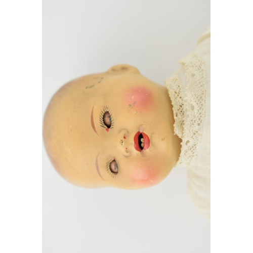 474 - Bisque head doll with sprayed head and moving eyes. AM made in Germany. Height 36cm.