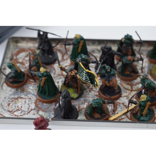 486 - A collection of cast metal and plastic war-games and miniature figures by 'Games Workshop' from the ... 