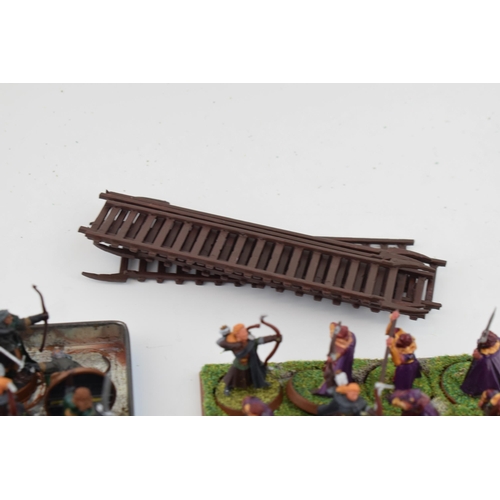 486 - A collection of cast metal and plastic war-games and miniature figures by 'Games Workshop' from the ... 