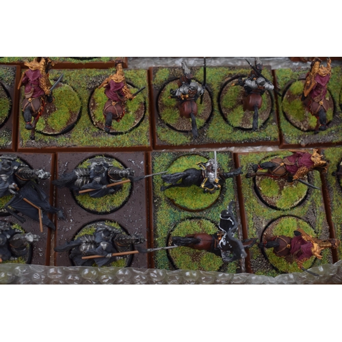 489 - A collection of cast metal and plastic war-games and miniature figures by 'Games Workshop' from the ... 