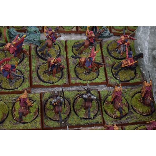 489 - A collection of cast metal and plastic war-games and miniature figures by 'Games Workshop' from the ... 