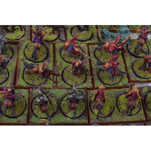 489 - A collection of cast metal and plastic war-games and miniature figures by 'Games Workshop' from the ... 