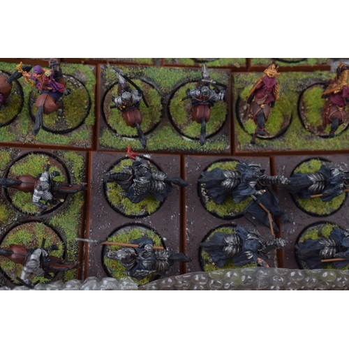 489 - A collection of cast metal and plastic war-games and miniature figures by 'Games Workshop' from the ... 