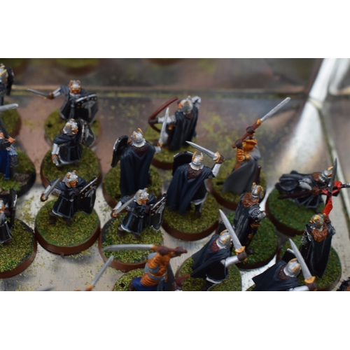 493 - A collection of cast metal war-games and miniature figures by 'Games Workshop' from the 'Lord of The... 