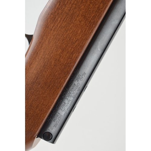 509 - A .177 calibre air rifle by WEIHRAUCH made in Germany. Length 100cm. Together with canvas gun slip.