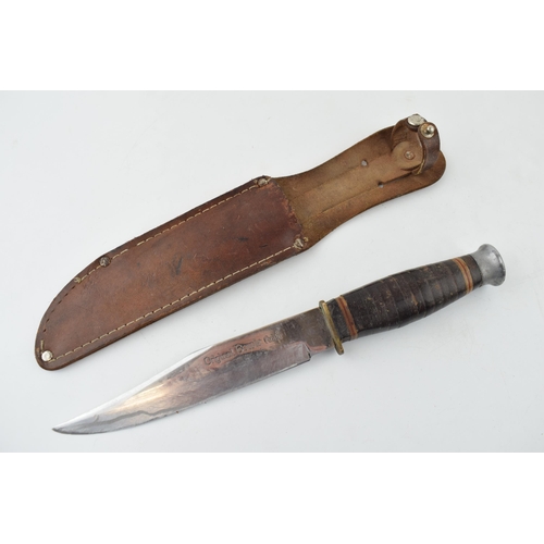 513 - Bowie knife in leather sheath, 'Made in Japan'. Lather handle, 'Stainless Steel Blade', 'Original Bo... 