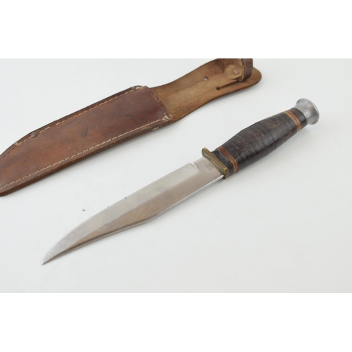 513 - Bowie knife in leather sheath, 'Made in Japan'. Lather handle, 'Stainless Steel Blade', 'Original Bo... 