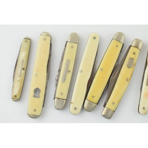 530 - A collection of antique and vintage bone and celluloid handled pocket knives to include Sheffield ma... 