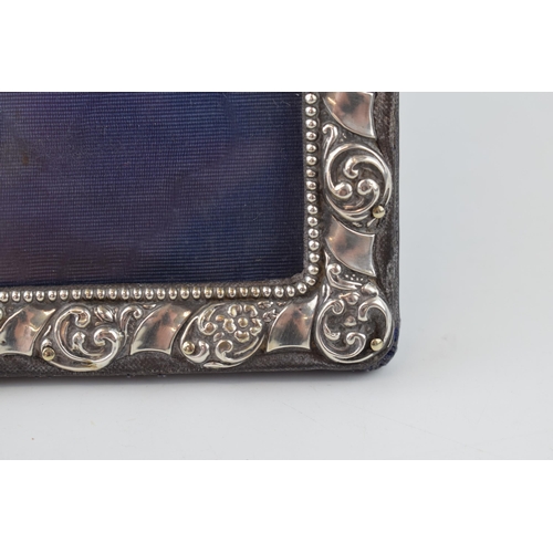 314E - Hallmarked silver photo frame, floral border, easel back, 25cm tall, Birm 1905.